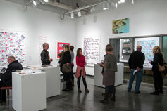 People attending an art exhibit in the Marsh Gallery at the Herron School of Art and Design